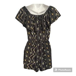 Almost Famous Knit Romper size medium. Black with floral pattern.